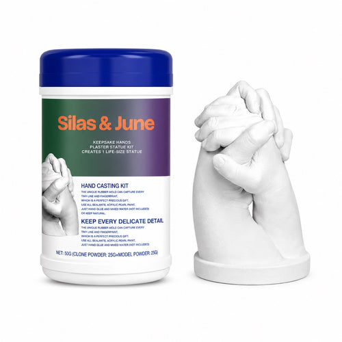 Silas & June Keepsake Hands casting kit canister next to a white plaster clasped-hands statue